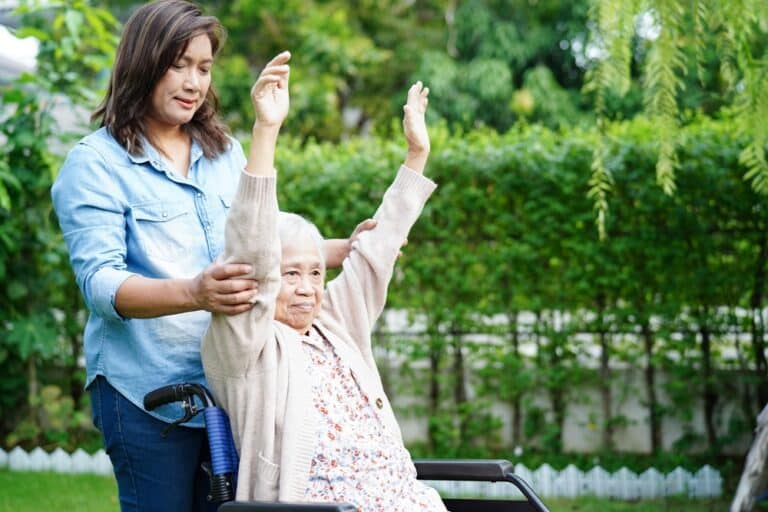 Asian,Elderly,Woman,Disability,Patient,Exercise,On,Wheelchair,With,Doctor